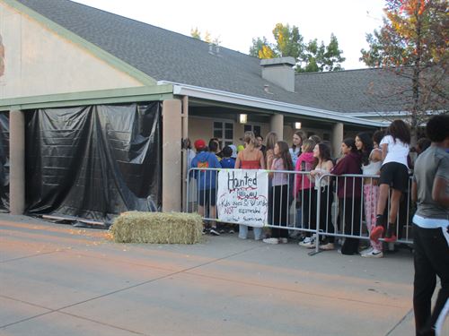 a crowd outside of a halloween exhibit