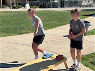 corn hole in action 